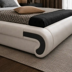 leatherette bed shown in a spacious bed layout with deep padded headboard