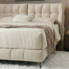 hydraulic storage bed shown in a spacious bed layout with thick padded headboard