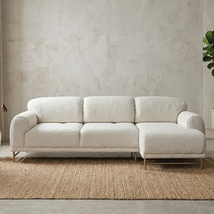Boucle sofa with rounded cushioned arms and metallic legs, full seating layout