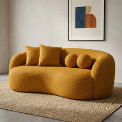 Lounge sofa with deep lounge seating and rounded arms, close-up of seat cushions
