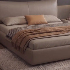 minimalist platform bed shown with a balanced mattress layout with curved padded headboard