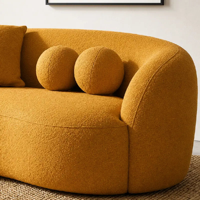 Luxury sofa with deep lounge seating and rounded arms, close-up of back cushions