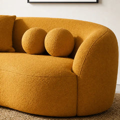 Luxury sofa with deep lounge seating and rounded arms, close-up of back cushions
