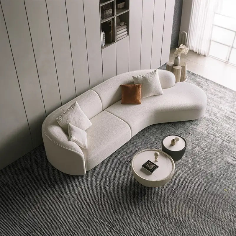 curved sofa with deep seat cushion and supportive backrest, upholstery close-up