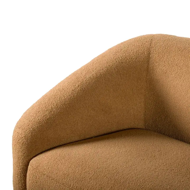 Fabric sofa with thick rounded arms and natural wooden legs, close-up of back cushions