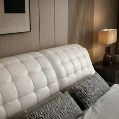 double bed with headboard showing the lift-up storage area with deep padded headboard