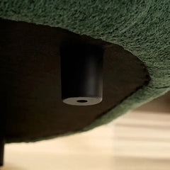 lounge sofa with side angle showing low curved backrest, upholstery close-up