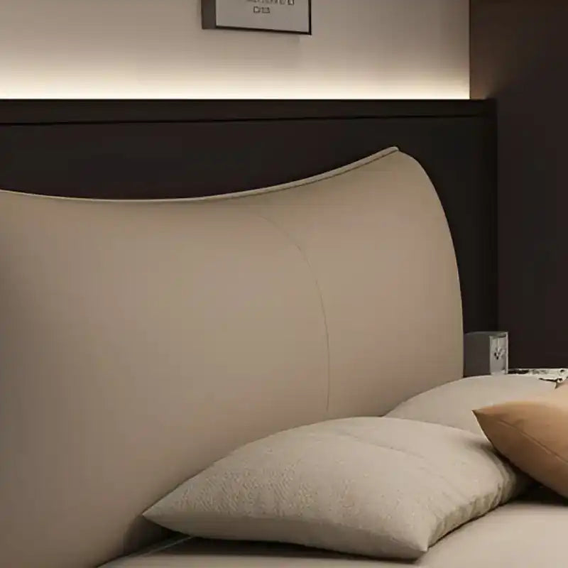 low profile platform bed close view of the upholstery and stitching with curved padded headboard