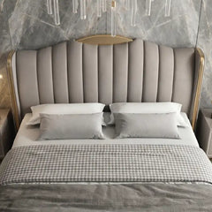 luxury bed shown in a spacious bed layout with wide side-panel headboard alternate side angle