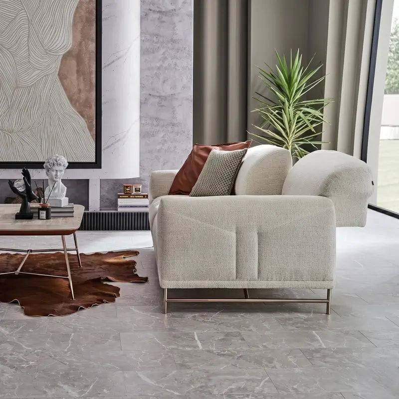 L shape sofa with rounded cushioned arms and metallic legs, armrest detail