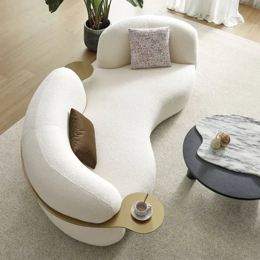 luxury sofa set with integrated gold-toned side tables and plush seating, three-quarter view