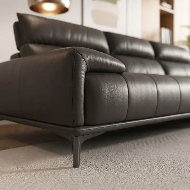 Leatherette sofa with deep cushions and segmented back support, armrest detail