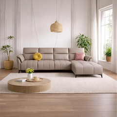 The leather sofa finish in a soft beige tone, paired with vertical channel detailing