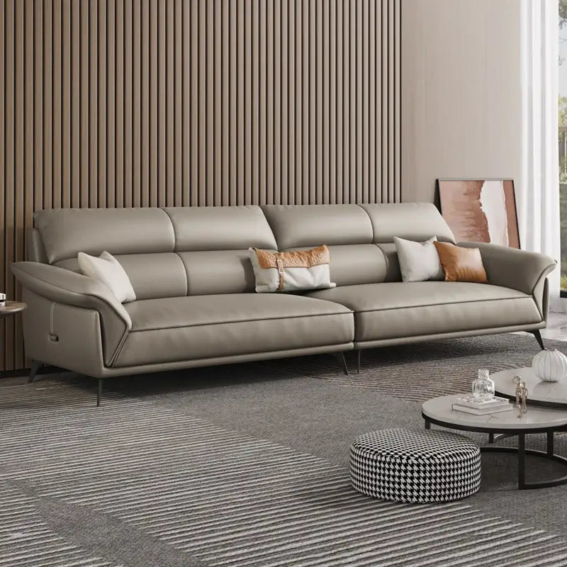 Leatherette sofa with deep lounge seating and soft back cushions, upholstery texture detail