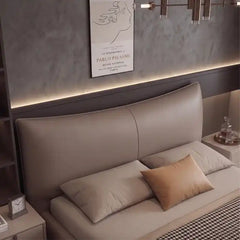 minimalist platform bed shown in a spacious bed layout with curved padded headboard alternate side angle
