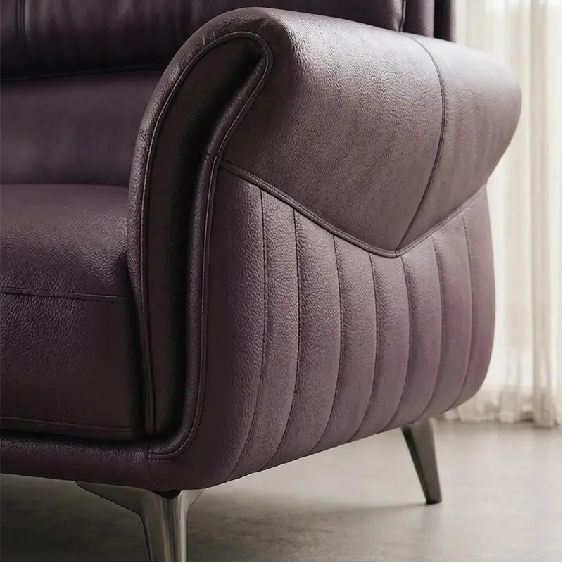 The plush cushioning, layered back support, and lounge chaise extension create a relaxing couch experience ideal for modern interiors