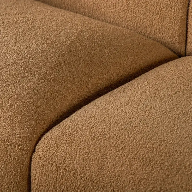 Fabric sofa with thick rounded arms and natural wooden legs, upholstery texture detail