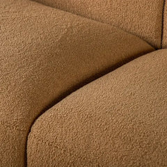 Fabric sofa with thick rounded arms and natural wooden legs, upholstery texture detail